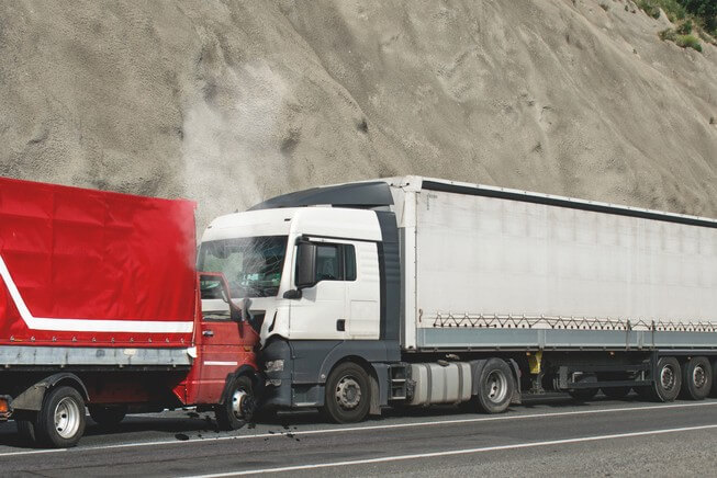 two trucks collide in a head on collision accident