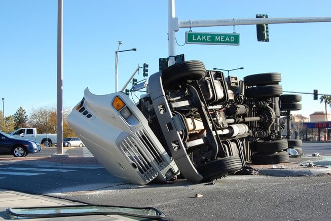 Commerical truck overturned on roadway accident