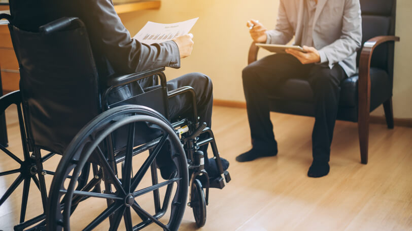 Injured man discusses settlement with his personal injury lawyer