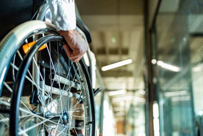 Paralyzed accident victim in wheelchair 