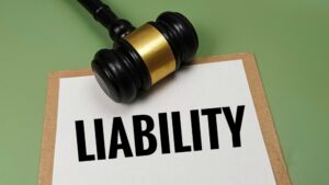 Gavel and liability concept. Learn when you can sue the trucking company and driver after a crash.
