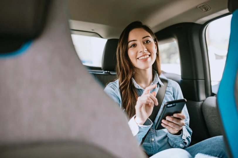 Passenger sits in the back of her Lyft vehicle 