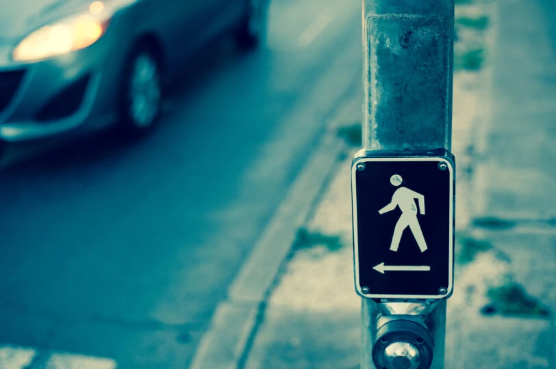 Car approaches pedestrian crosswalk
