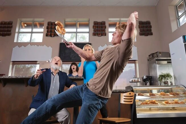 Man with food falls in restaurant